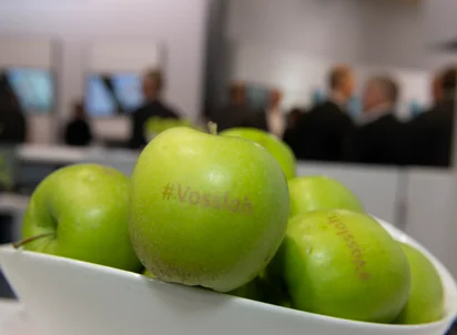 Green apple with Vossloh branding